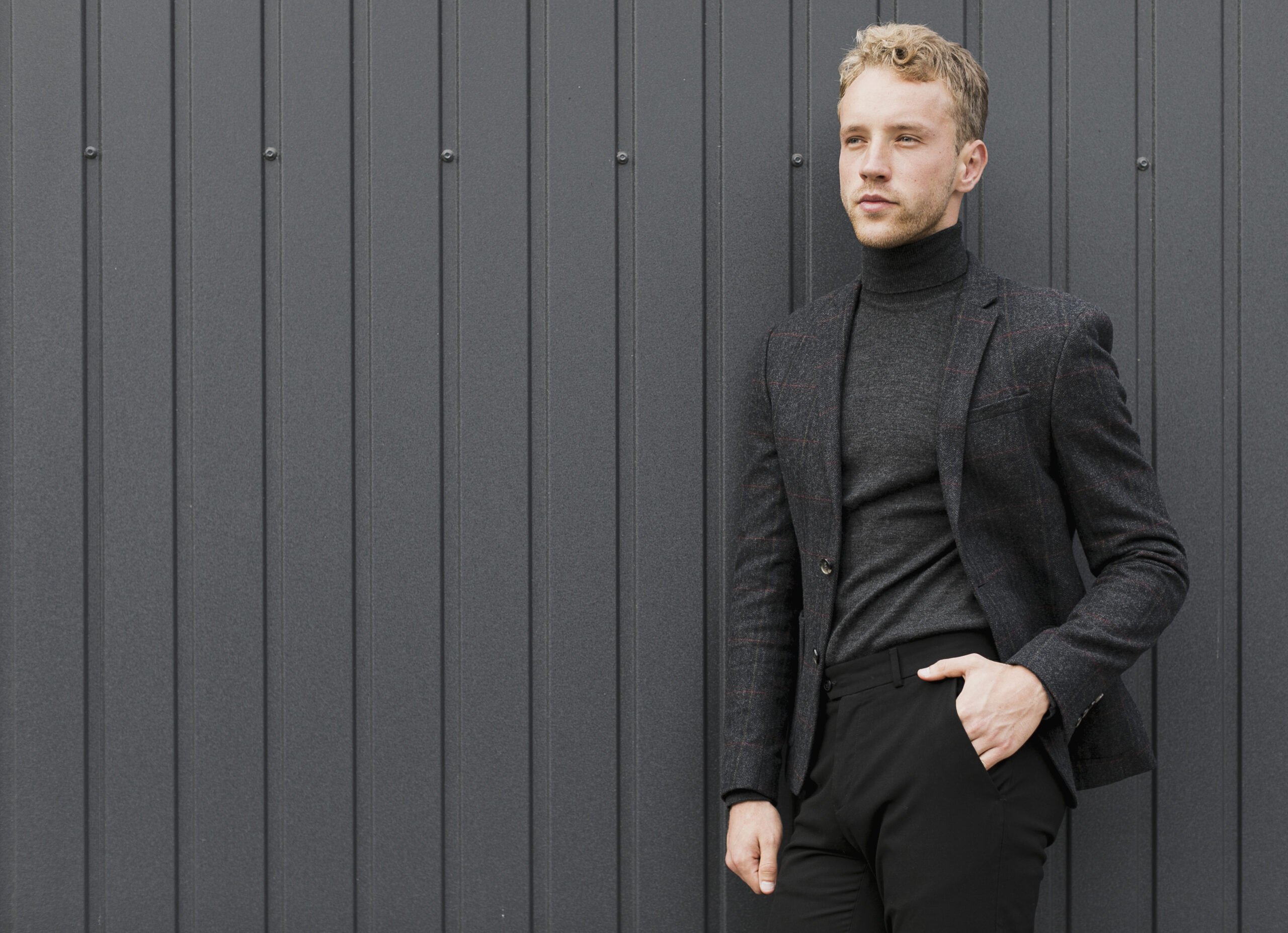 handsome-man-holding-his-hand-his-trouser-pocket
